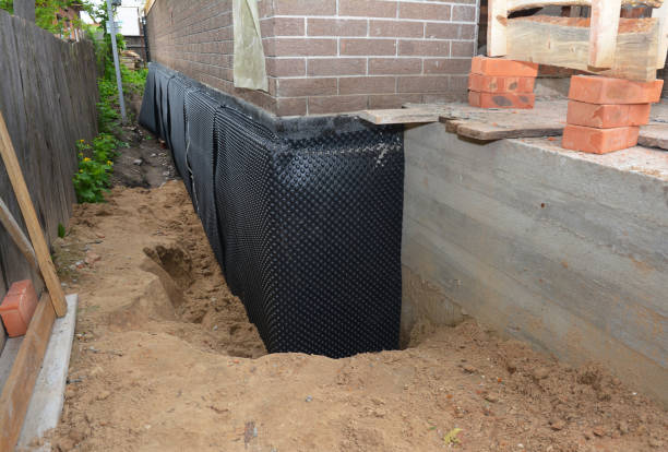 Happy homeowners after waterproofing job in Pigeon Forge